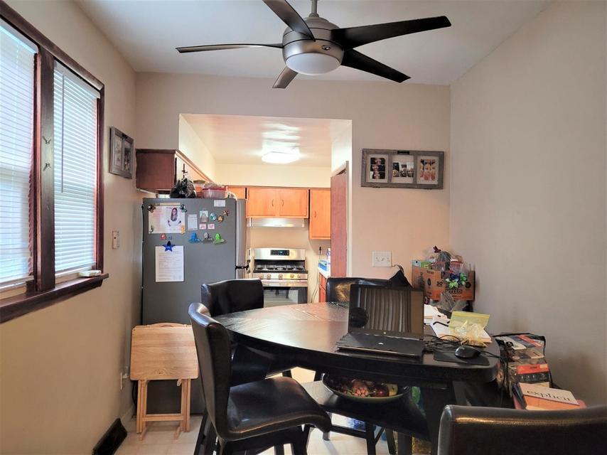 1718 Roosevelt Place Gary, IN 46404 - Photo 5 of 18 a view of a dining room with furniture and a window