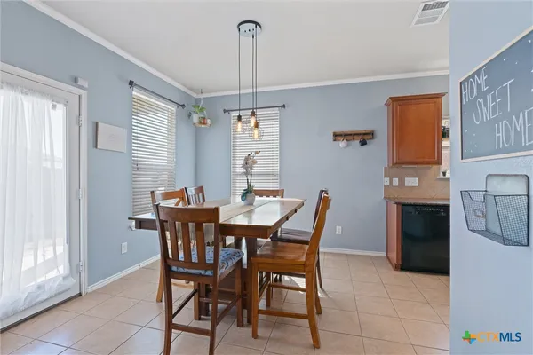 a view of a dining room with furniture
