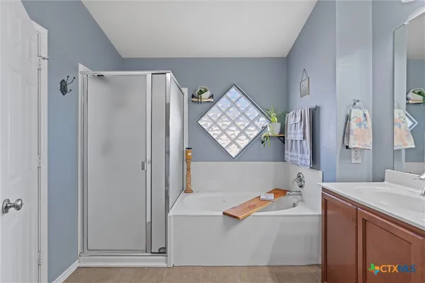 a bathroom with a bathtub and a sink