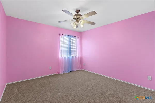 a very nice looking room with a ceiling fan