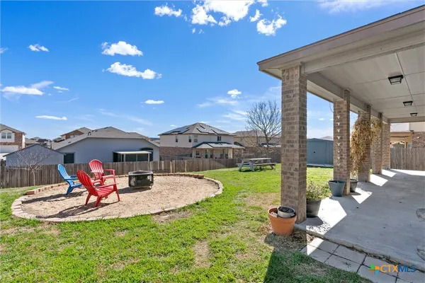 a front view of a house with a garden and patio