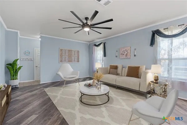 a living room with furniture and a large window