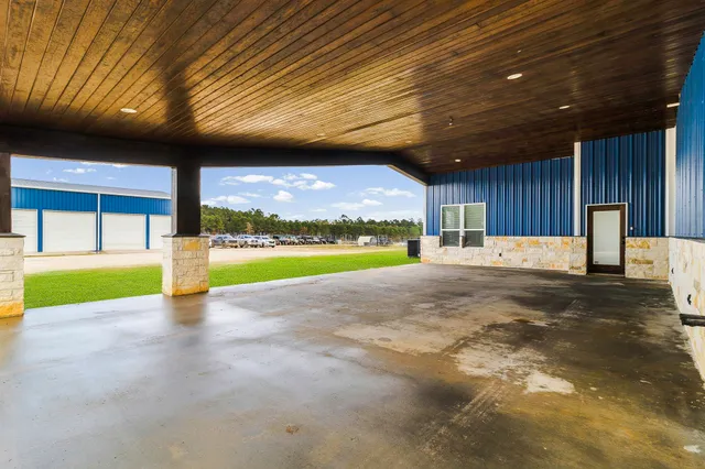 a view of an swimming pool with a patio