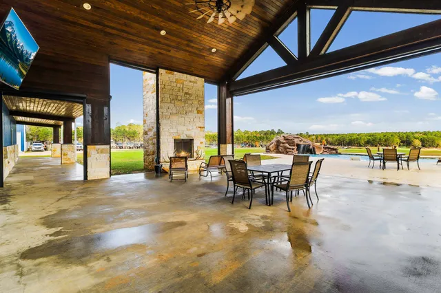 a view of a swimming pool with a table and chairs
