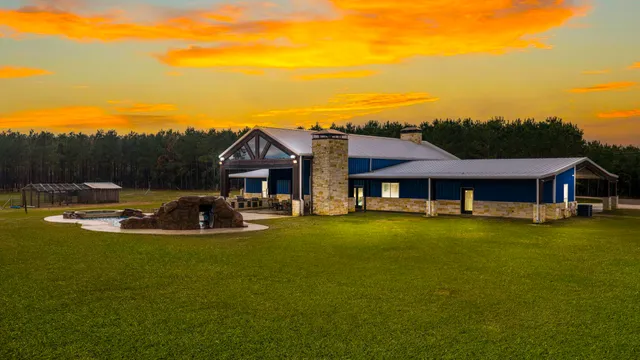 a view of a house with pool table and chairs