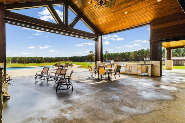 a view of swimming pool with outdoor seating
