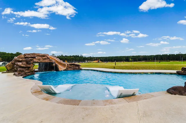 a view of a lake with houses in the back