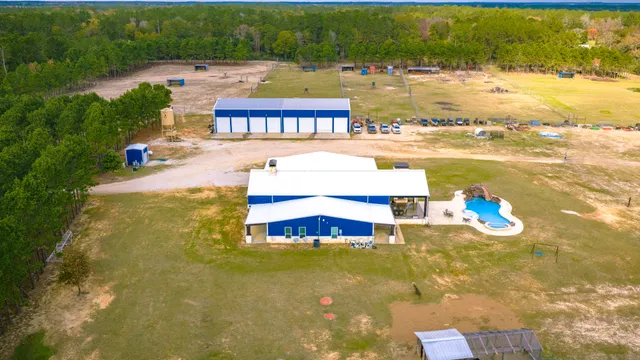 a swimming pool with outdoor seating and yard