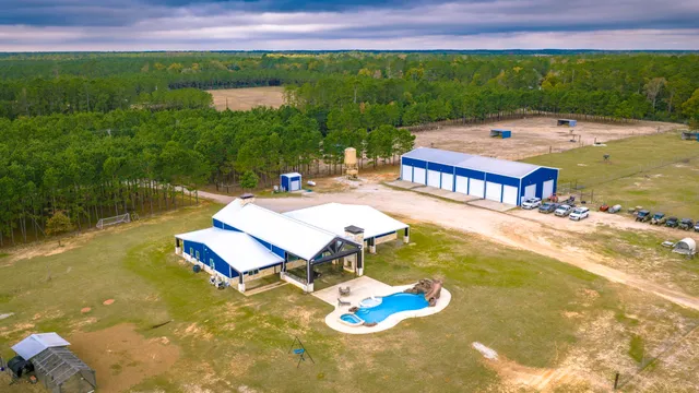 a view of a swimming pool with a yard