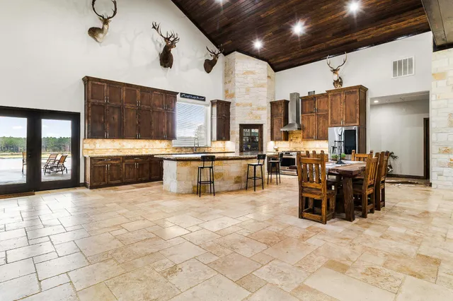 a view of a kitchen and dining area
