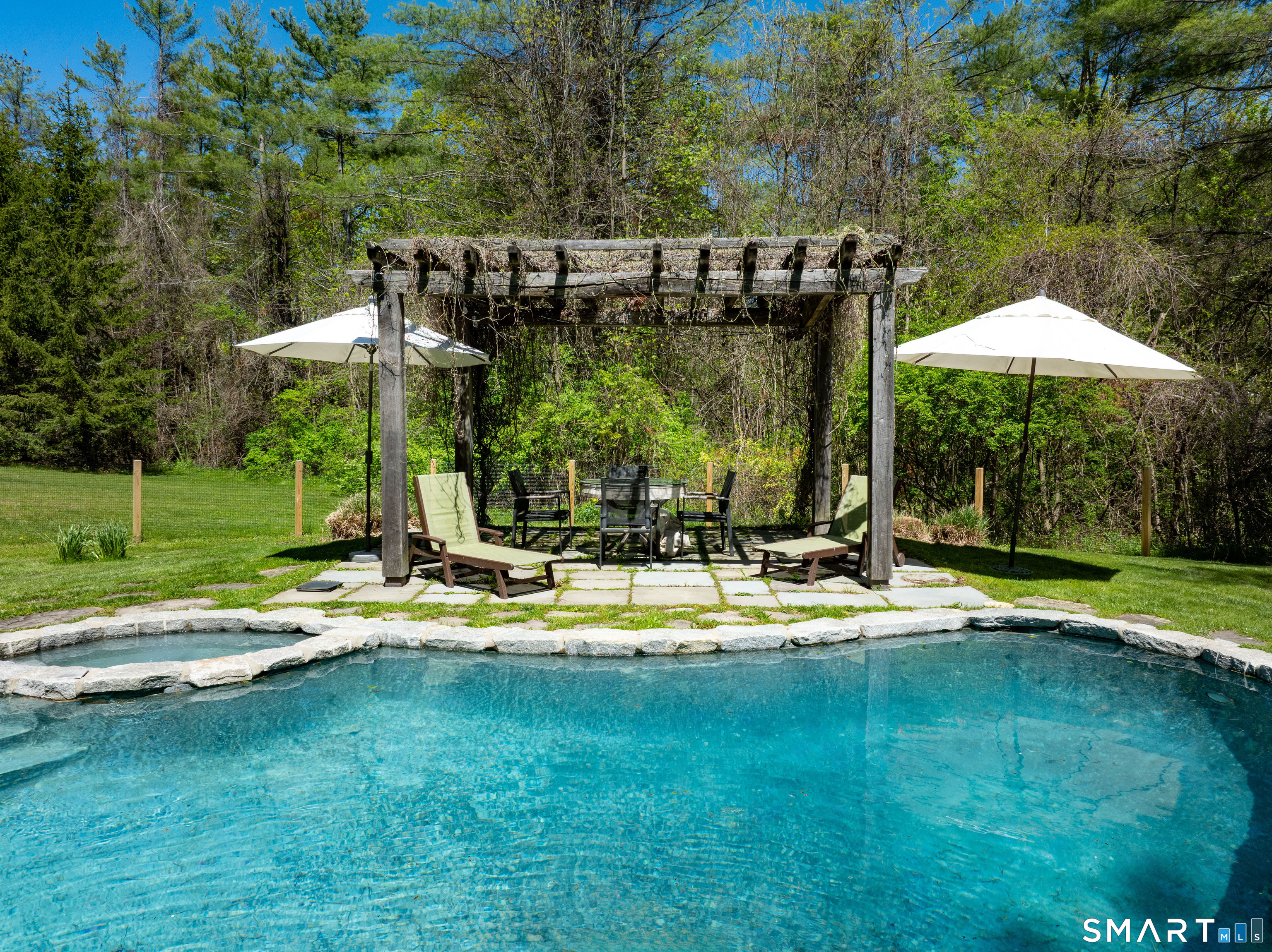 7 Cooper Hill Road Salisbury, CT 06068 - Photo 19 of 36 a view of a house with swimming pool and sitting area