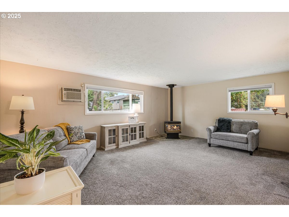 2604 Southeast 176th Place Portland, OR 97236 - Photo 13 of 27 a living room with furniture and a window
