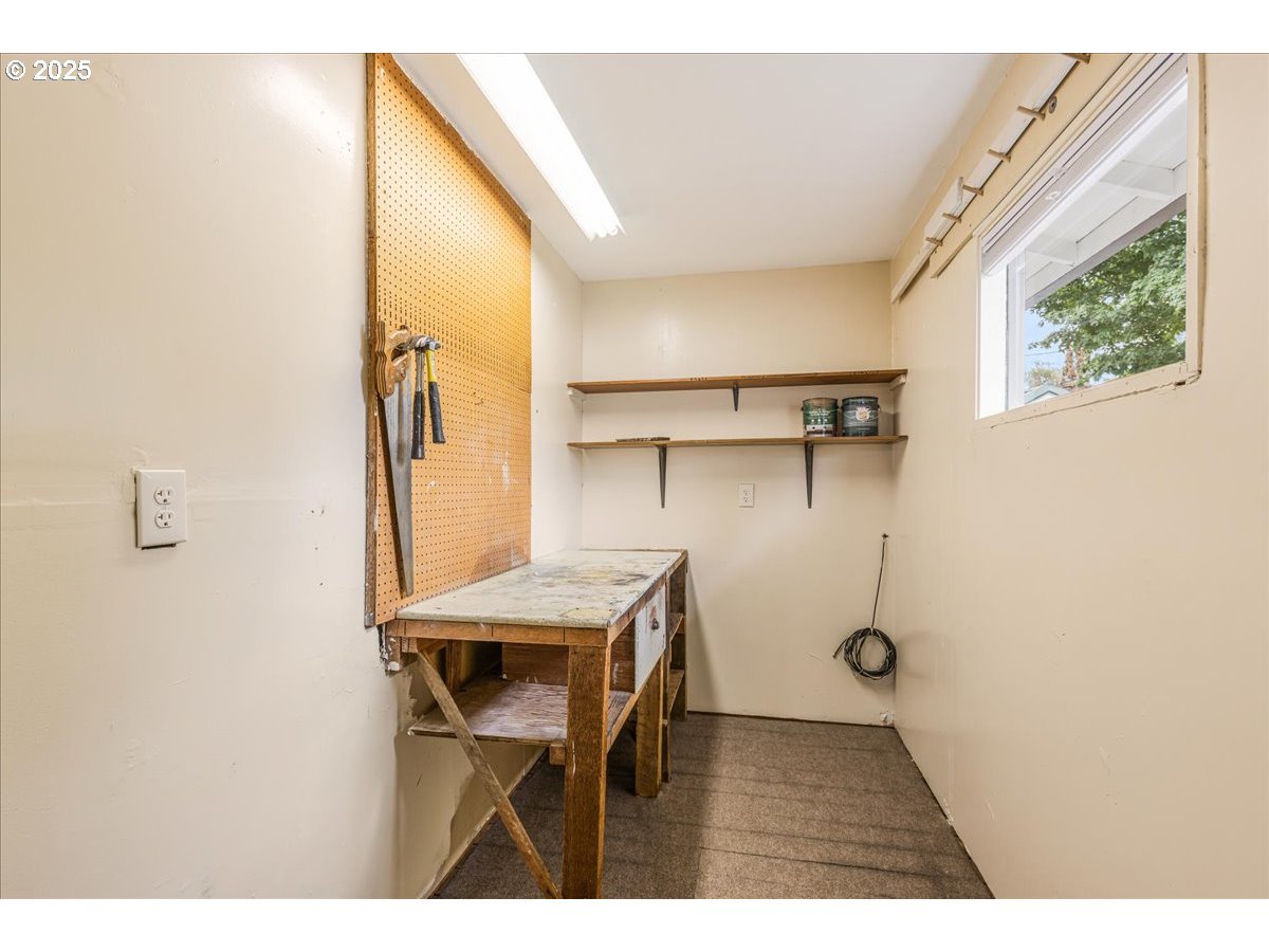 2604 Southeast 176th Place Portland, OR 97236 - Photo 15 of 27 a view of a room with shelves and windows