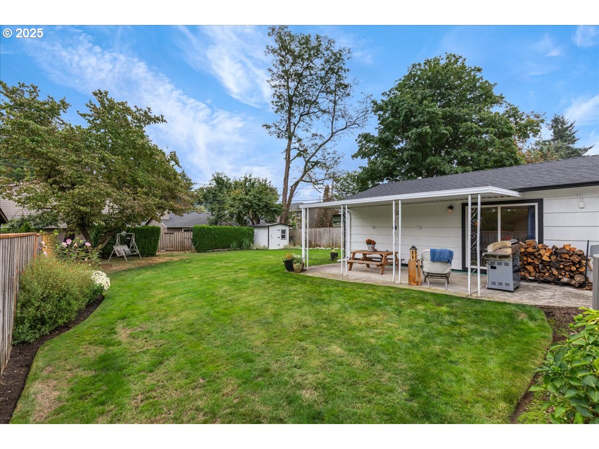 2604 Southeast 176th Place Portland, OR 97236 - Photo 24 of 27 a front view of house with yard and outdoor seating