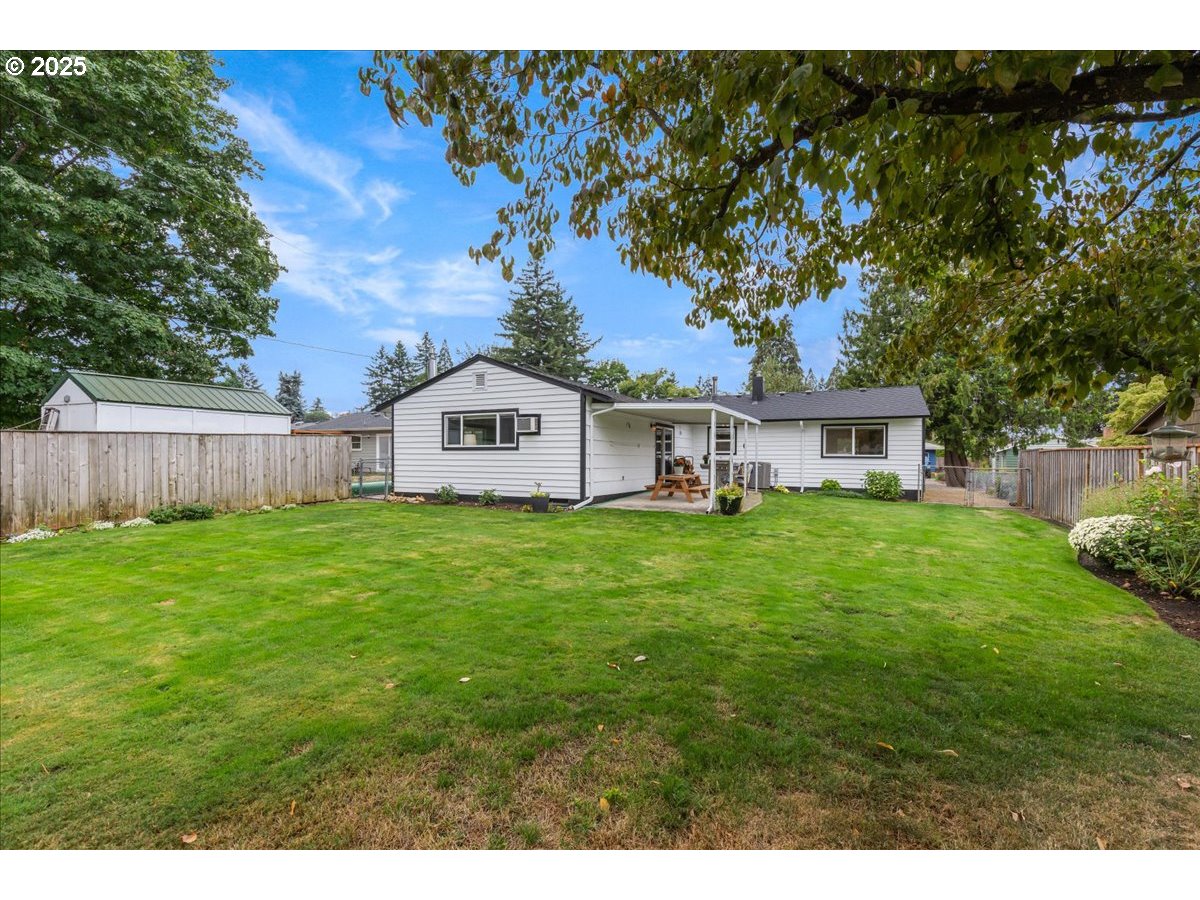 2604 Southeast 176th Place Portland, OR 97236 - Photo 25 of 27 a view of a house with a yard