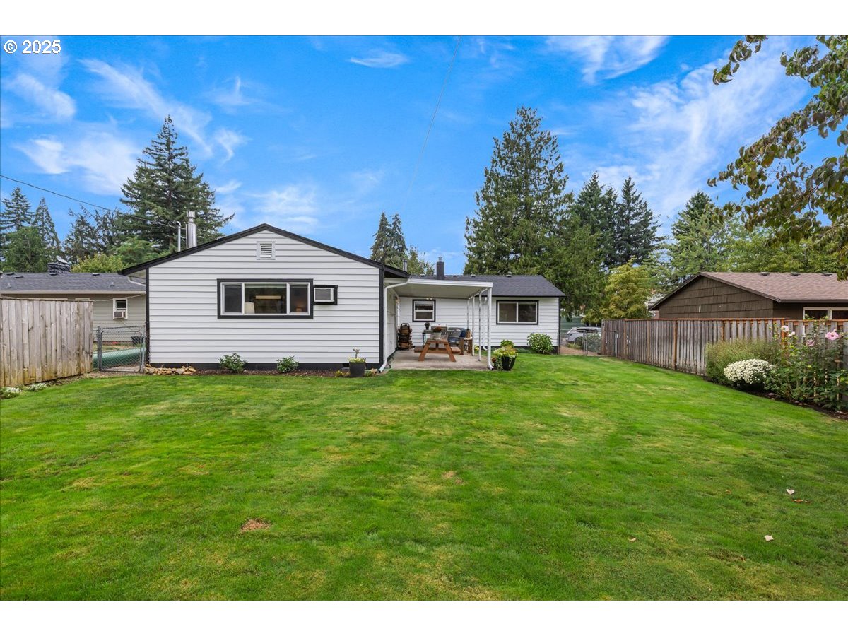 2604 Southeast 176th Place Portland, OR 97236 - Photo 26 of 27 a front view of a house with a garden