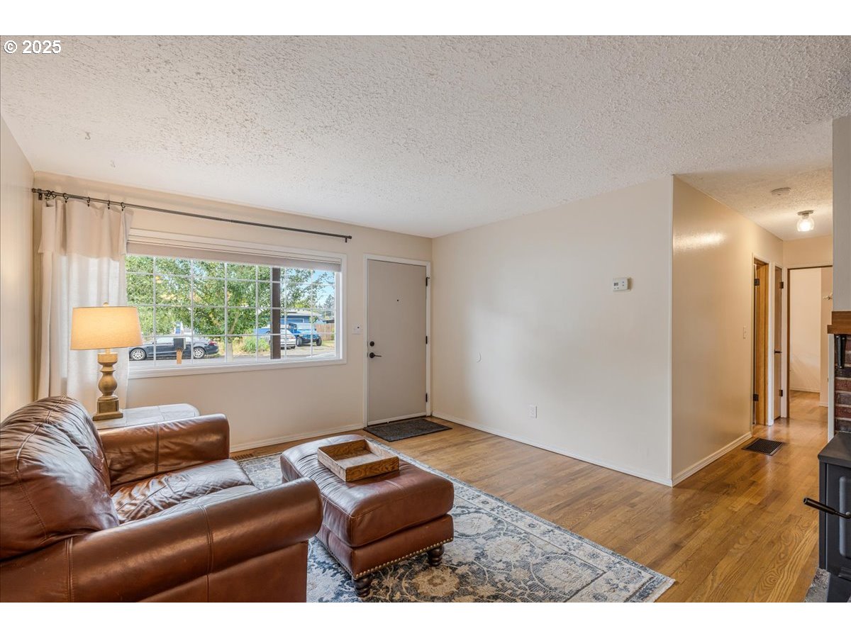 2604 Southeast 176th Place Portland, OR 97236 - Photo 4 of 27 a living room with furniture and a window