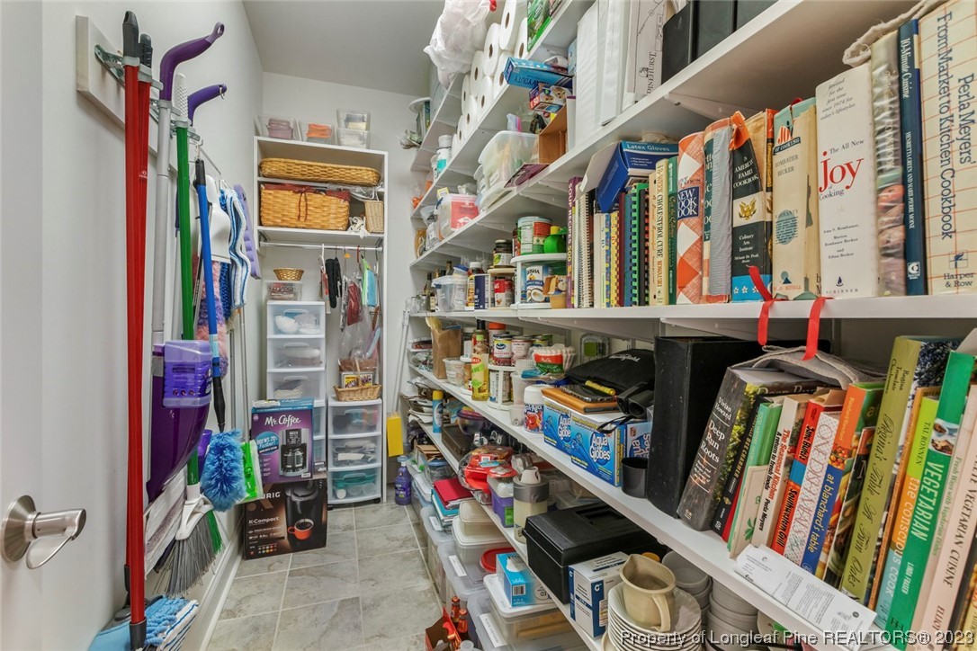 4 The Pointe Sanford, NC 27332 - Photo 25 of 50 a view of walk in closet with clothes and shoes