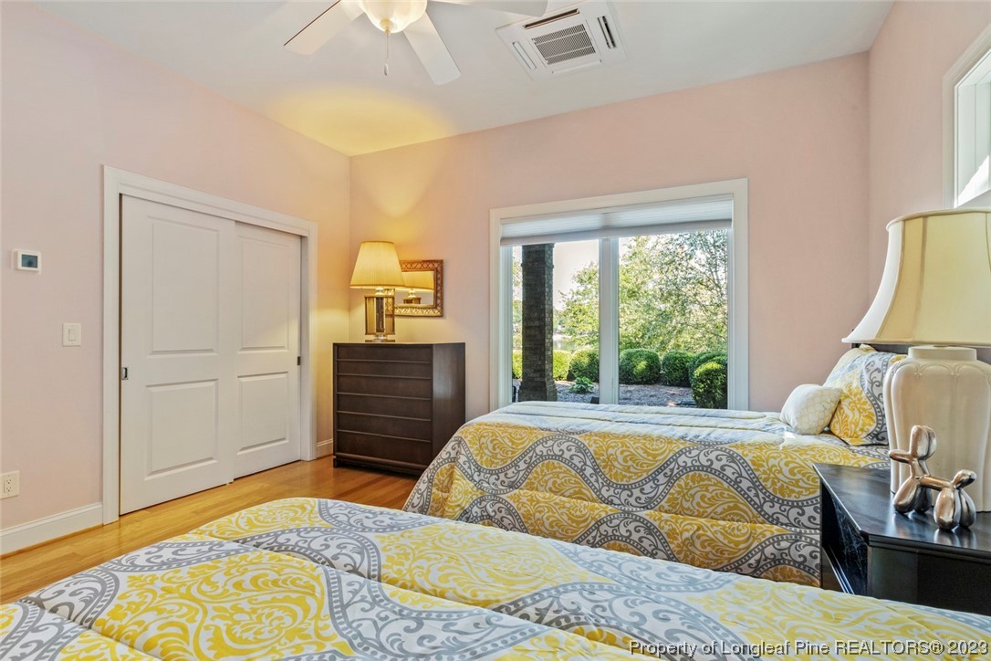 4 The Pointe Sanford, NC 27332 - Photo 37 of 50 a bedroom with a bed and wooden floor