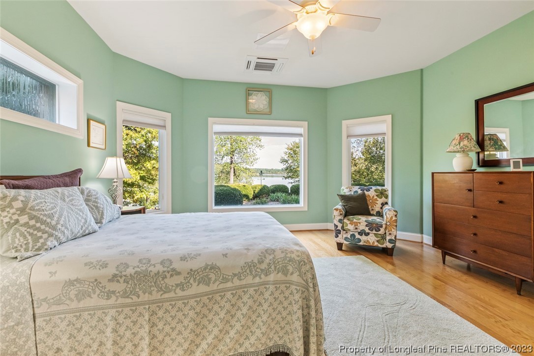 4 The Pointe Sanford, NC 27332 - Photo 39 of 50 a bedroom with a bed and large windows