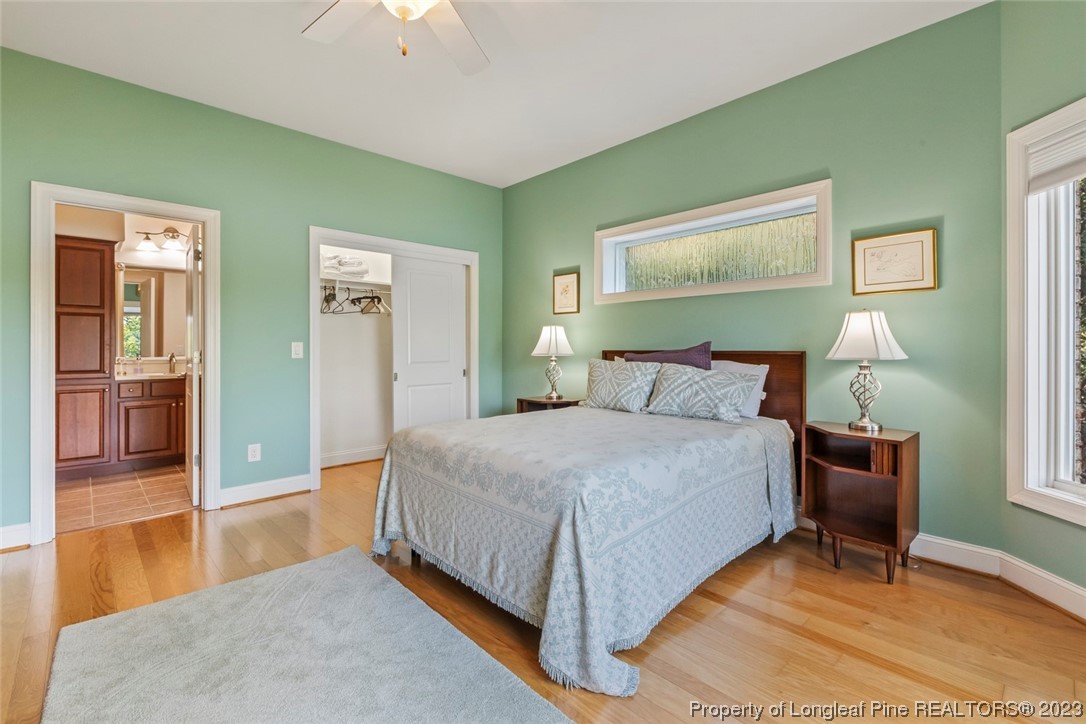 4 The Pointe Sanford, NC 27332 - Photo 40 of 50 a bedroom with a bed and a chandelier