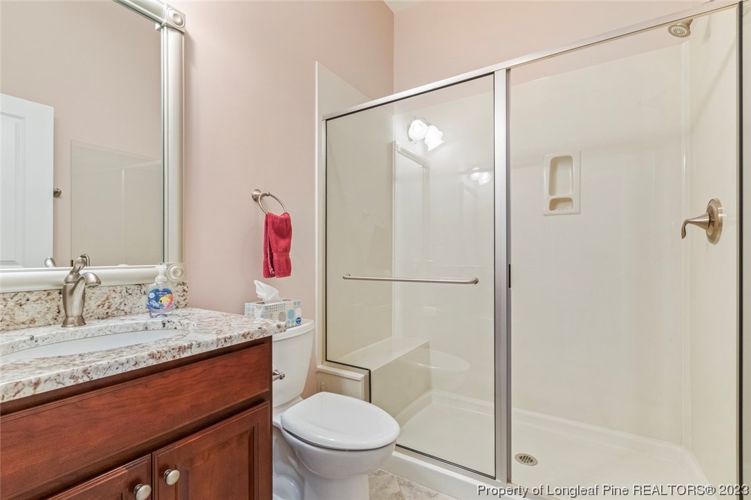 4 The Pointe Sanford, NC 27332 - Photo 41 of 50 a bathroom with a granite countertop sink toilet and shower