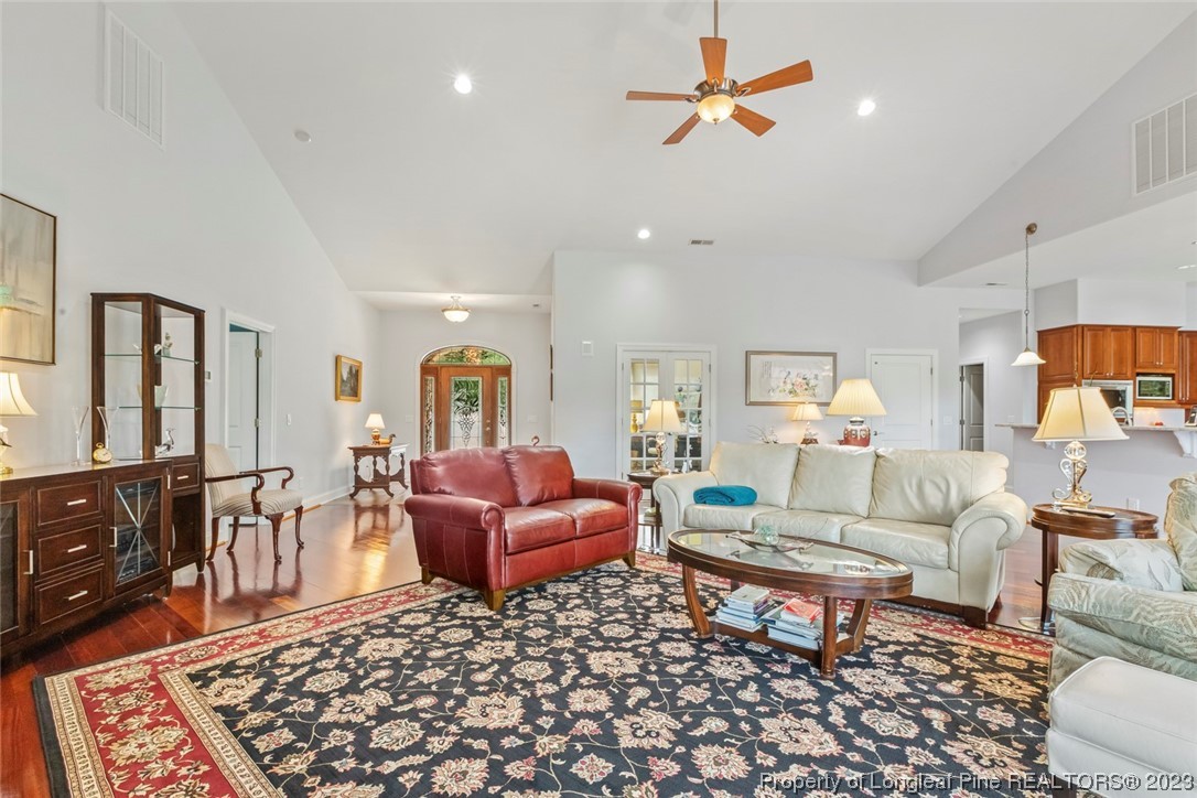 4 The Pointe Sanford, NC 27332 - Photo 10 of 50 a living room with furniture a rug and a chandelier