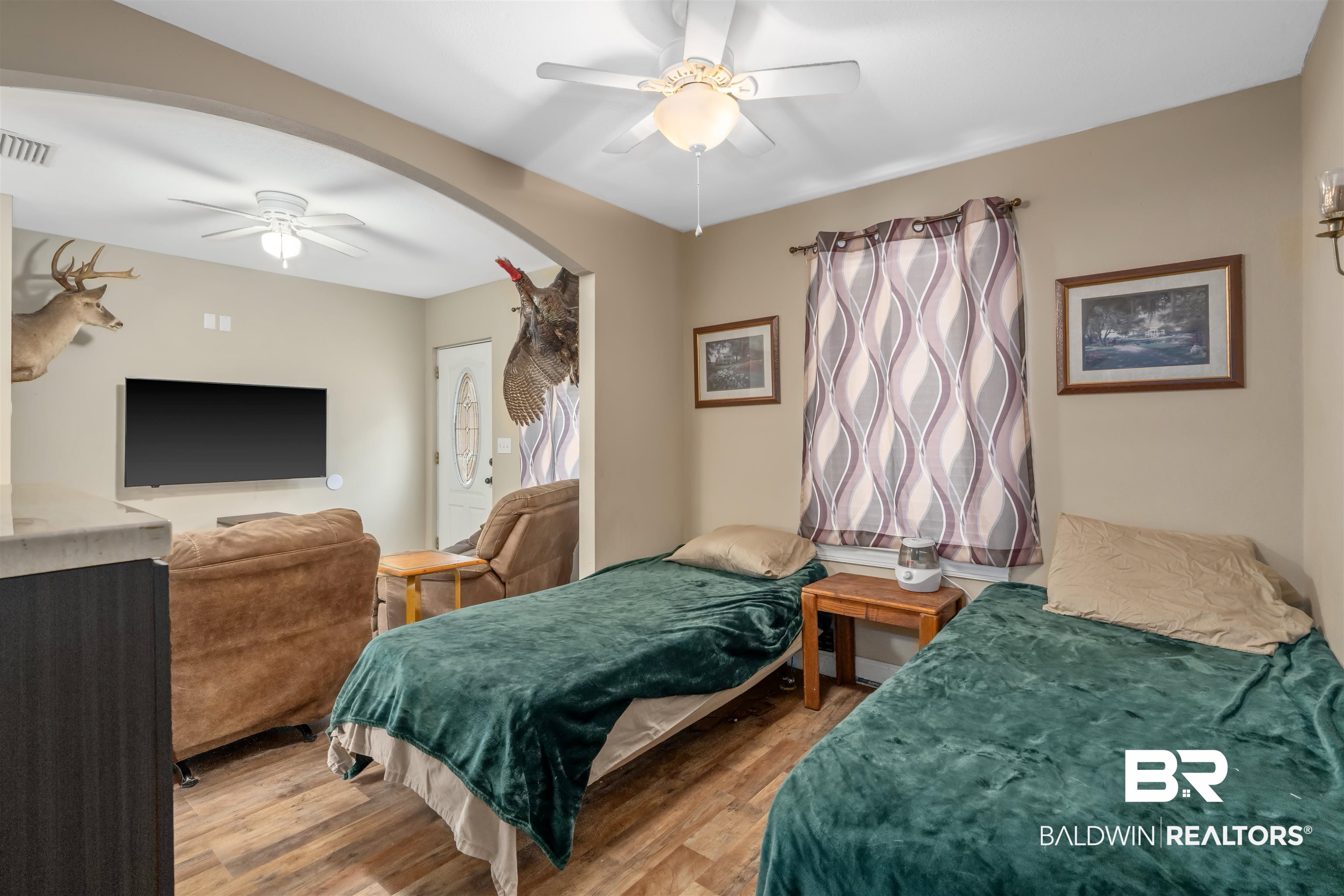 23186 Pecan Street Robertsdale, AL 36567 - Photo 20 of 36 Bedroom featuring wood finished floors and a ceiling fan