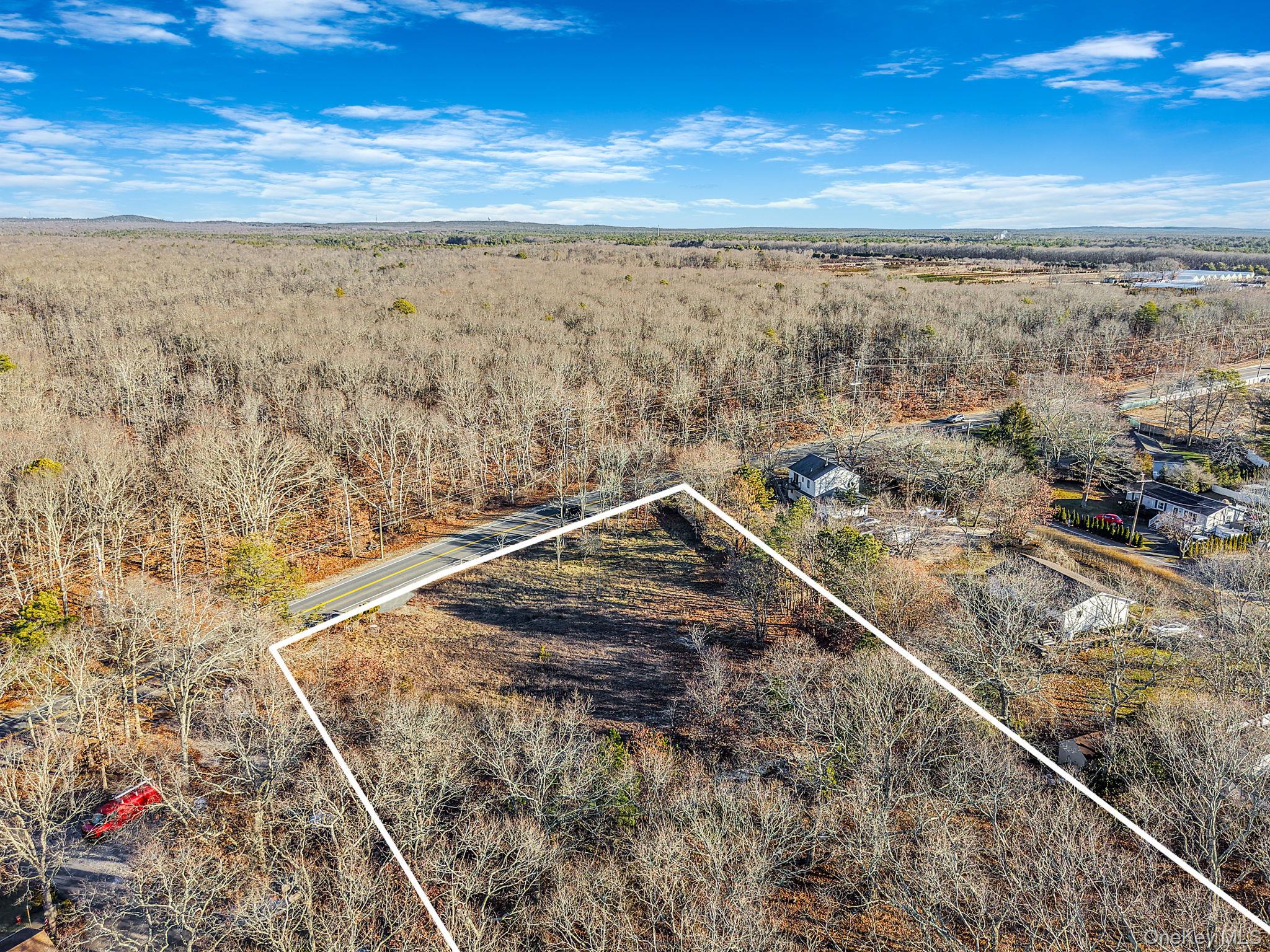 267 Old Country Road Eastport, NY 11941 - Photo 13 of 17 View of property location with property boundaries highlighted and a heavily wooded area