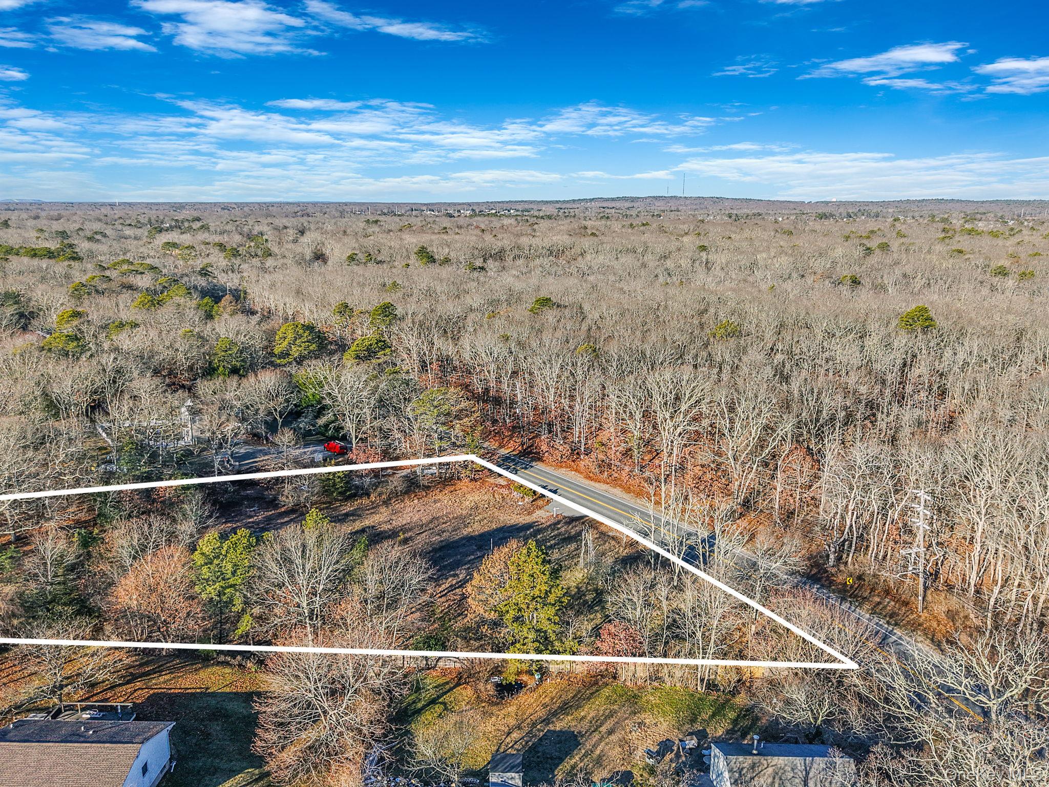 267 Old Country Road Eastport, NY 11941 - Photo 8 of 17 Aerial view of property and surrounding area featuring property parcel outlined