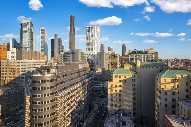 a view of a dining room with furniture and window