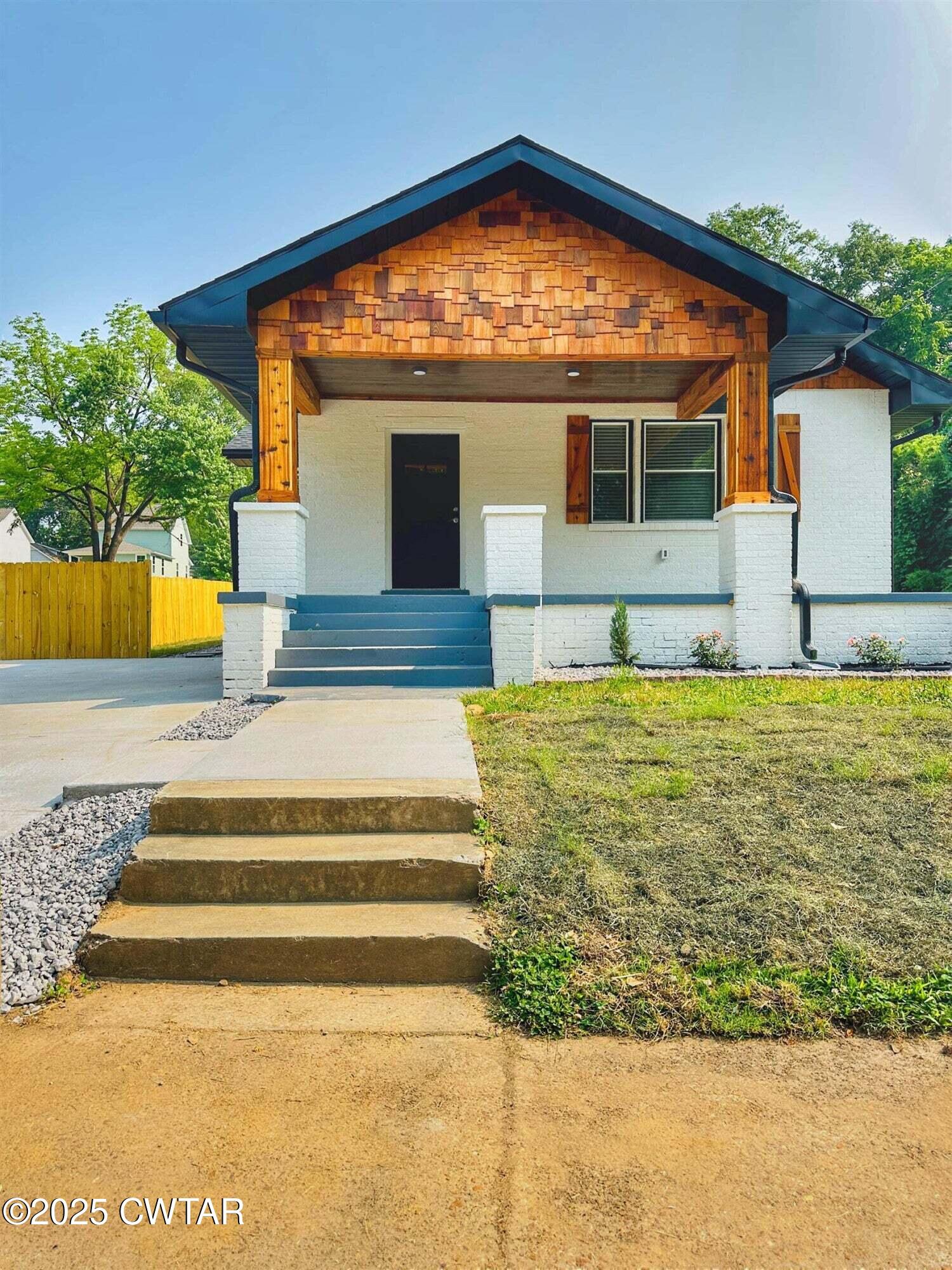 a view of swimming pool with an outdoor seating
