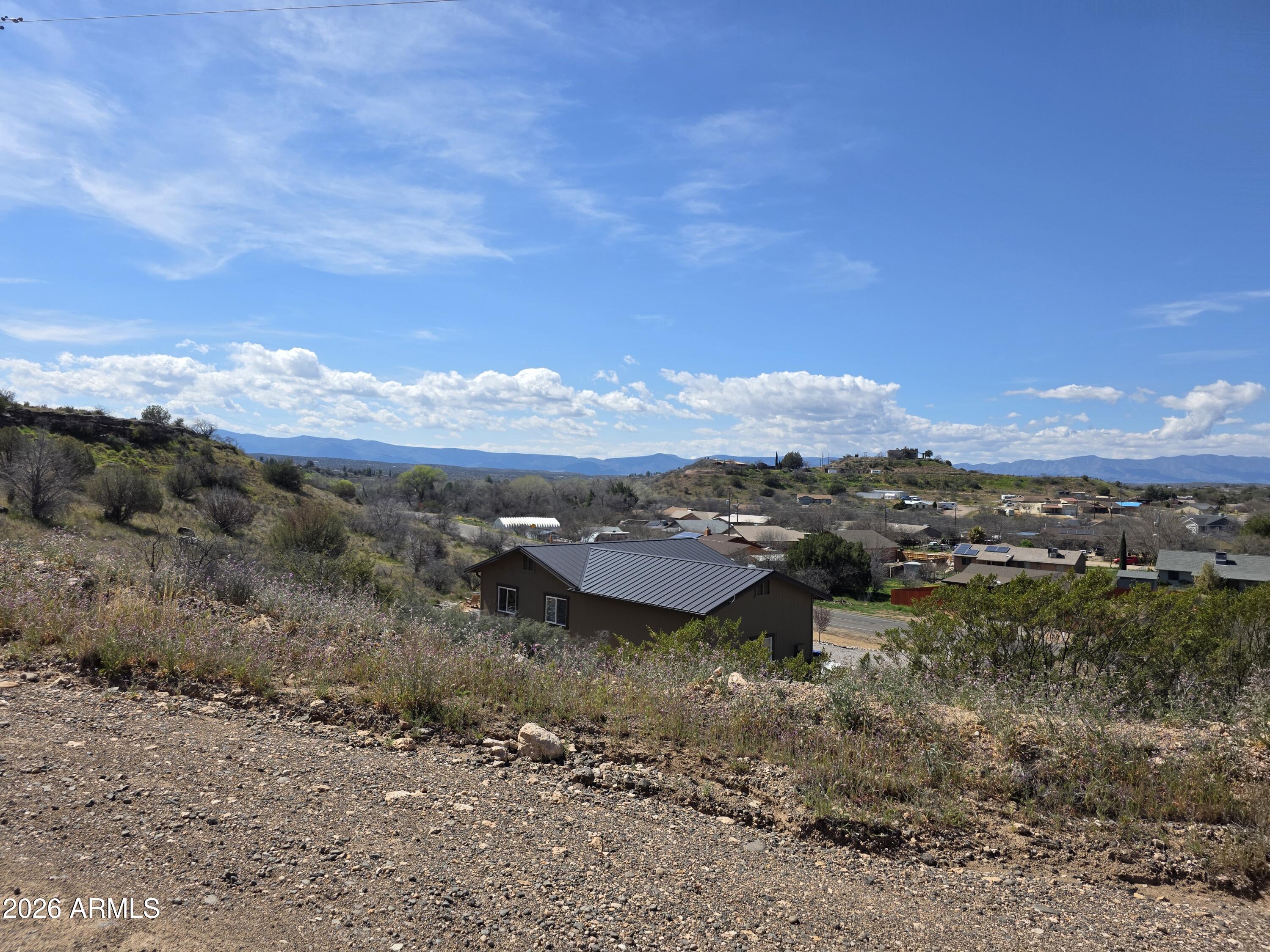 4870 East Goss Road, Unit 684 Rimrock, AZ 86335 - Photo 4 of 8 a view of a lake with mountains in the background