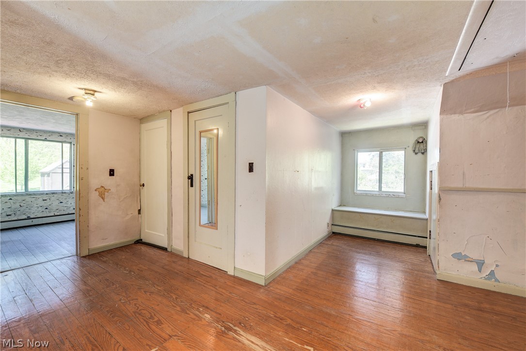 343 Bellus Road Hinckley, OH 44233 - Photo 34 of 49 Upstairs open area between bedrooms. Hardwood flooring
