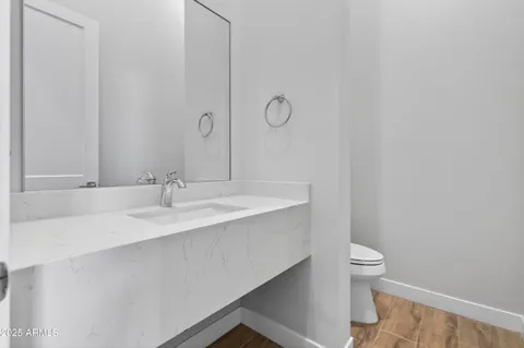 a bathroom with a sink toilet and vanity