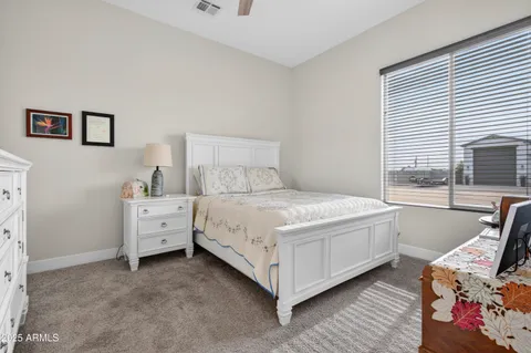 a bedroom with a bed and a dresser
