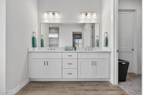 a bath tub sitting in a bathroom next to a window