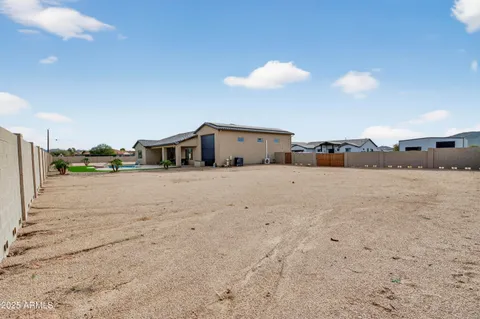 a view of swimming pool with a yard