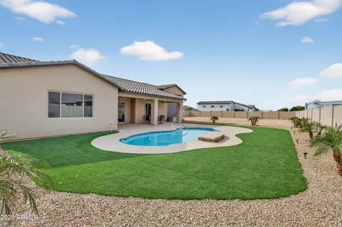 a view of a living room and kitchen