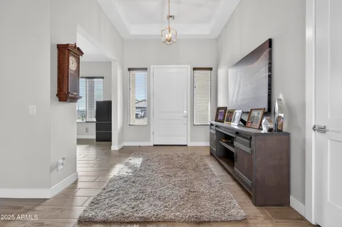 a view of kitchen with sink microwave and refrigerator