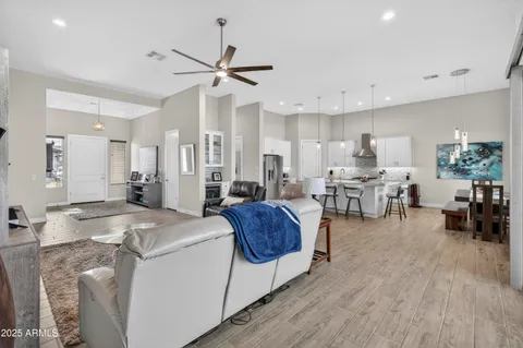 a living room with furniture and kitchen view