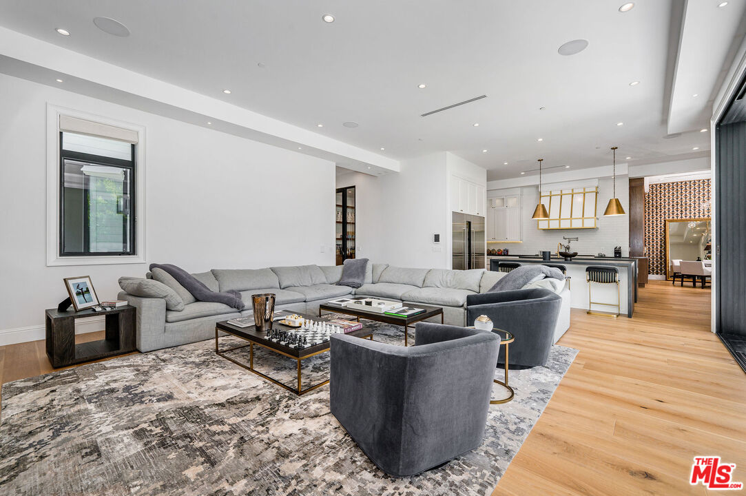 4421 Haskell Avenue Encino, CA 91436 - Photo 14 of 32 a living room with furniture and a wooden floor