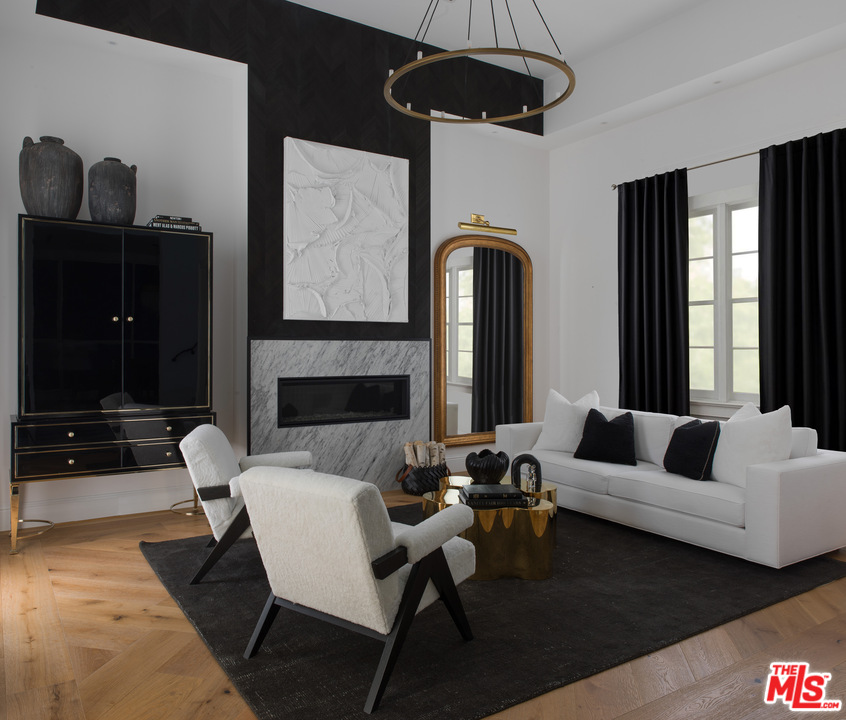 4421 Haskell Avenue Encino, CA 91436 - Photo 3 of 32 a living room with furniture and a fireplace