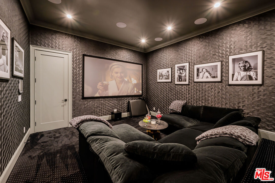 4421 Haskell Avenue Encino, CA 91436 - Photo 24 of 32 a living room with furniture and a flat screen tv