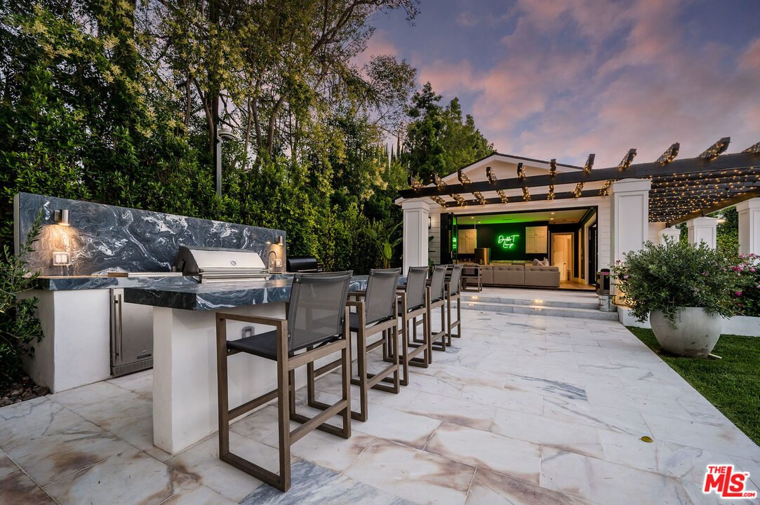 4421 Haskell Avenue Encino, CA 91436 - Photo 29 of 32 a view of a chairs and table in the patio