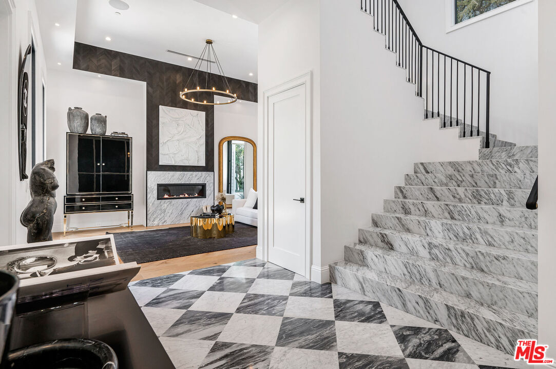 4421 Haskell Avenue Encino, CA 91436 - Photo 4 of 32 a bedroom with furniture and wooden floor