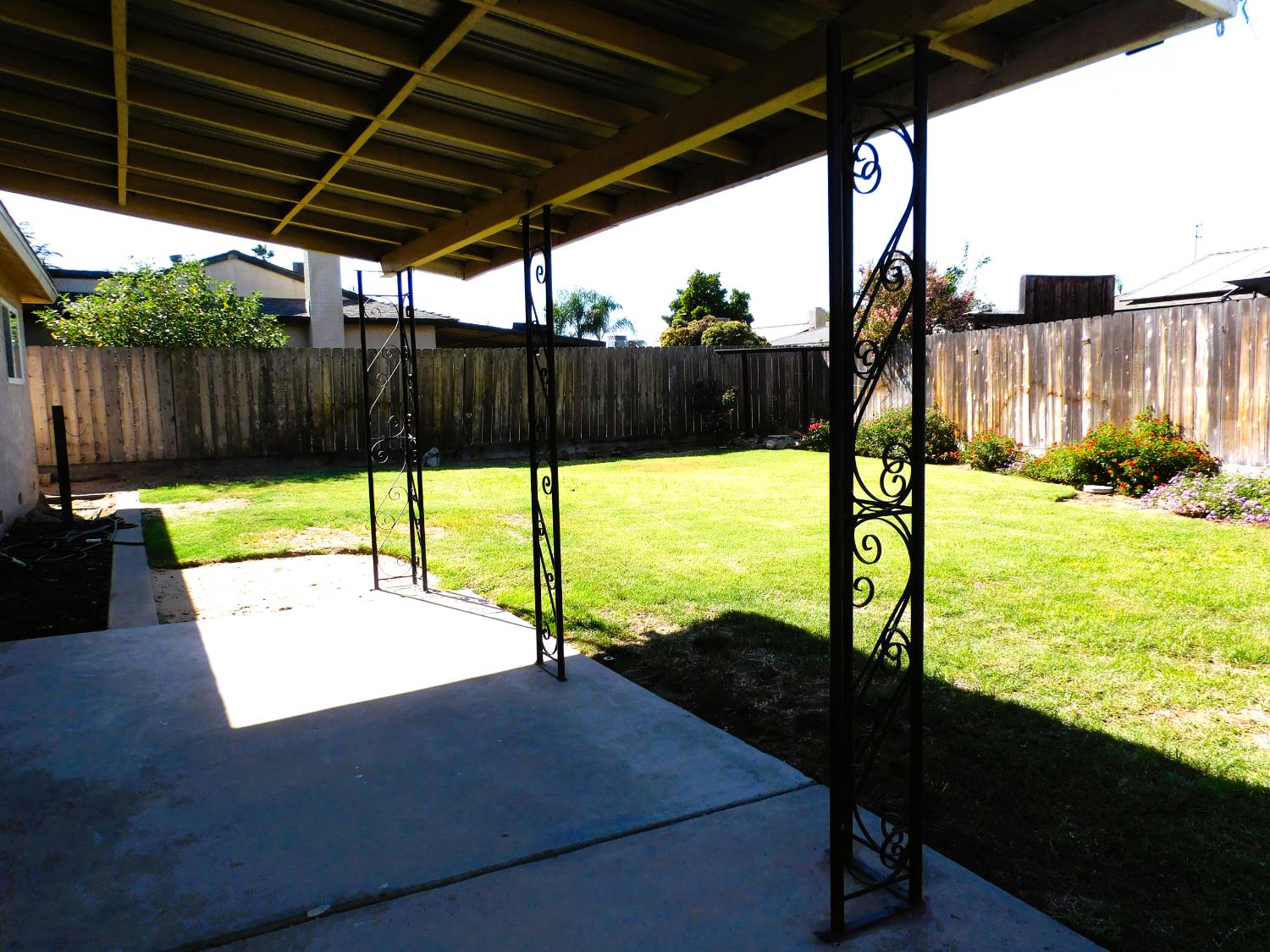 51 West Richert Avenue Clovis, CA 93612 - Photo 12 of 13 a view of a deck with wooden floor next to a yard
