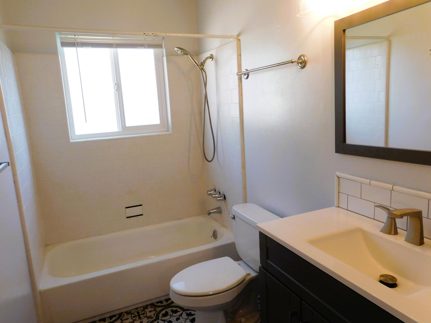 51 West Richert Avenue Clovis, CA 93612 - Photo 5 of 13 a bathroom with a sink toilet and shower