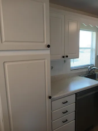 a kitchen with a sink and a cabinets