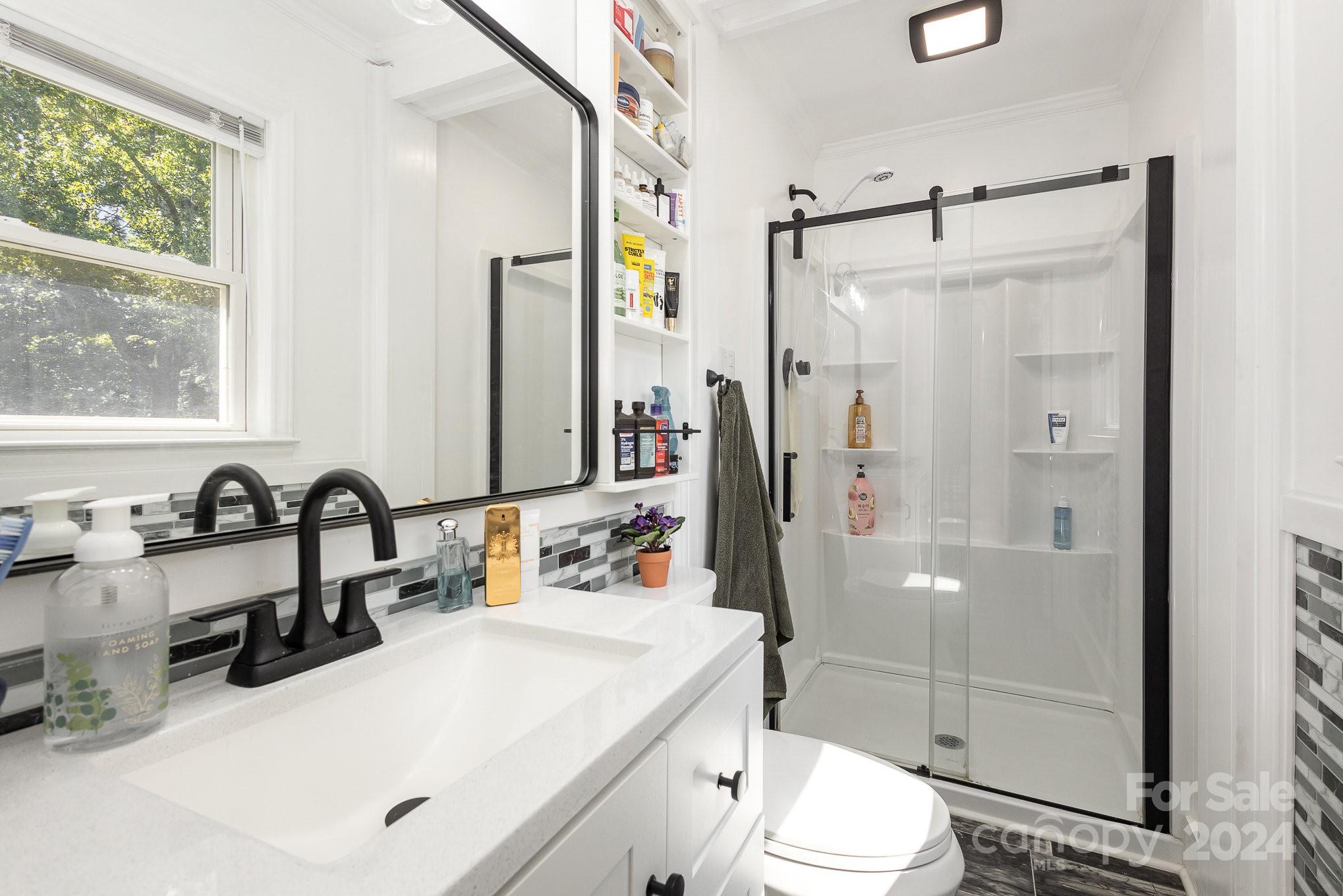 4431 Westridge Drive Charlotte, NC 28208 - Photo 15 of 24 a bathroom with a sink toilet and shower